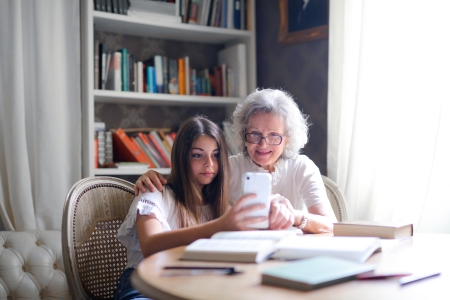 grandma and her daughter with a smartphone