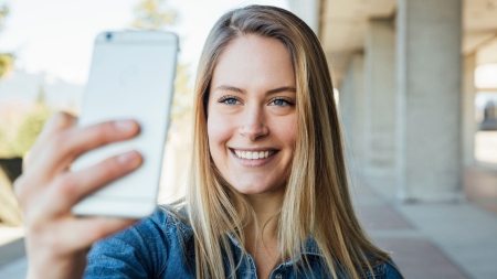 A woman takes a selfie