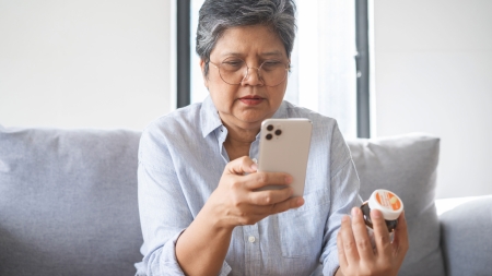 A woman uses her smartphone